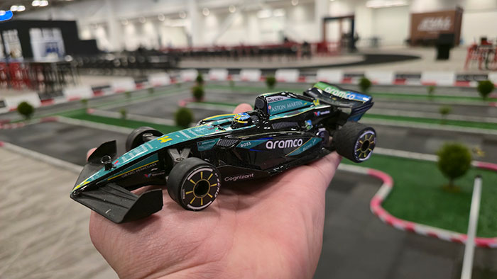 Corporate guests racing F1 replica RC cars at sales kick-off event