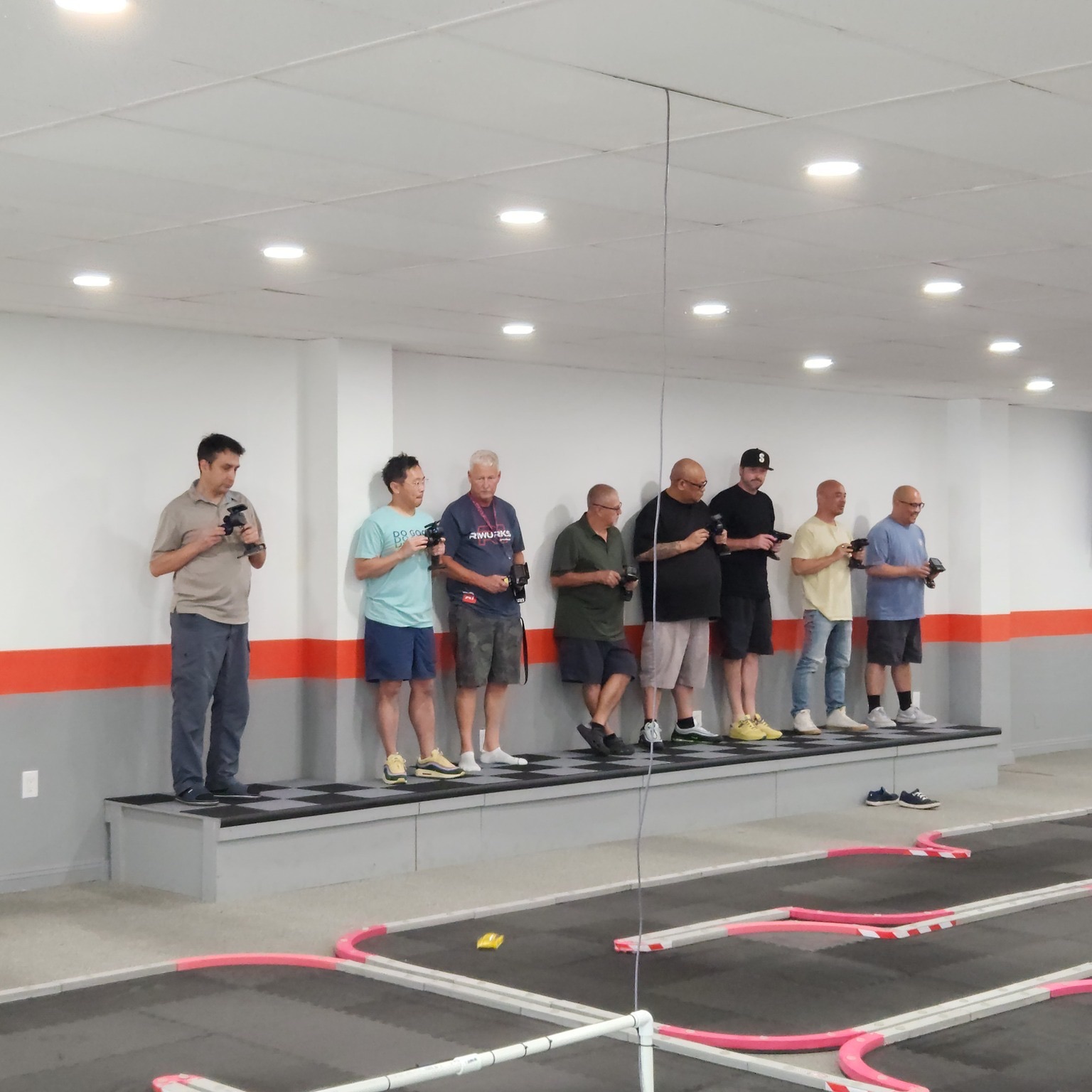 Adults competing in an RC racing tournament in Los Angeles