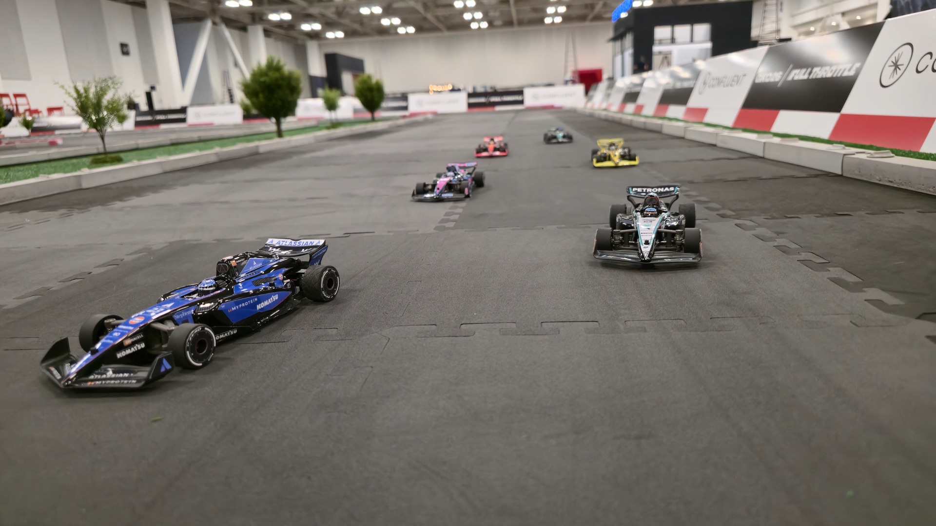 F1 replica RC cars racing at Confluent GKO26 activation, Seattle Convention Center
