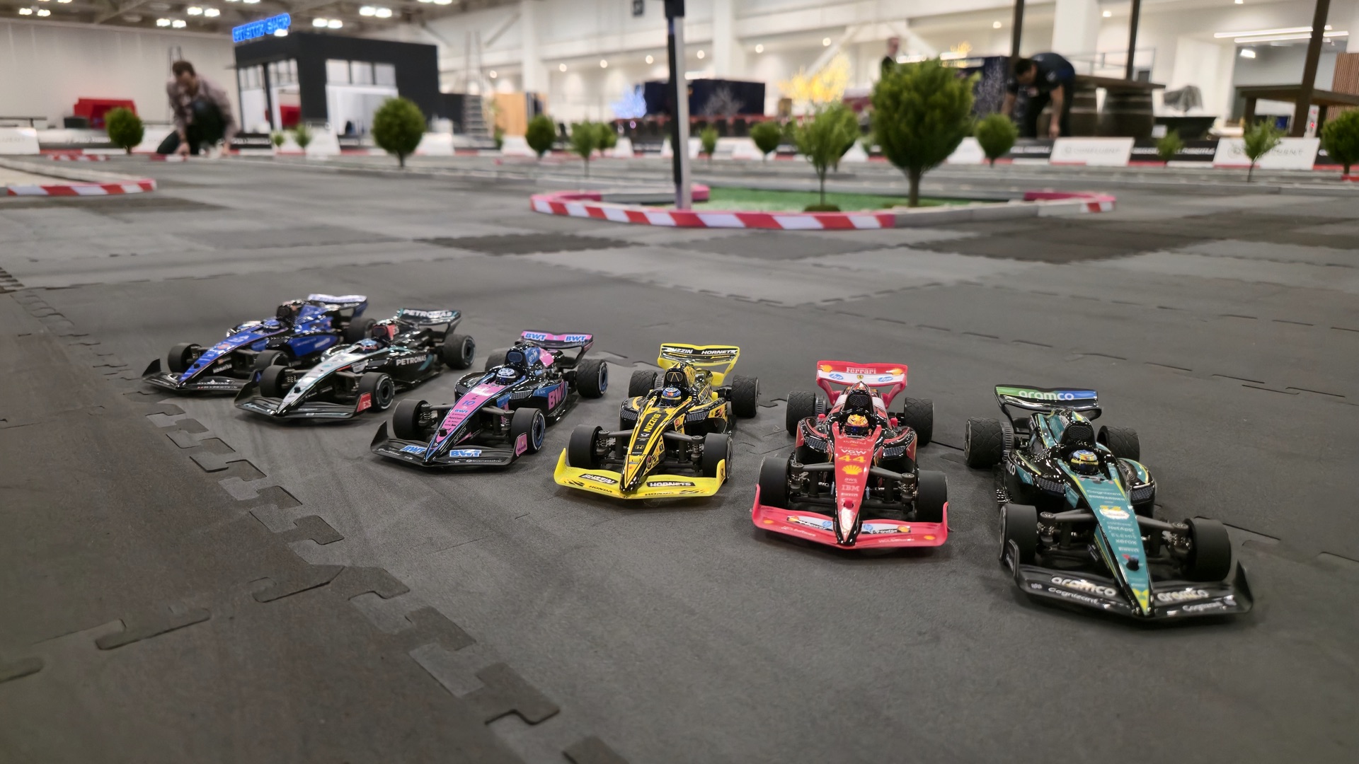 F1 replica RC cars on the starting grid at a corporate activation
