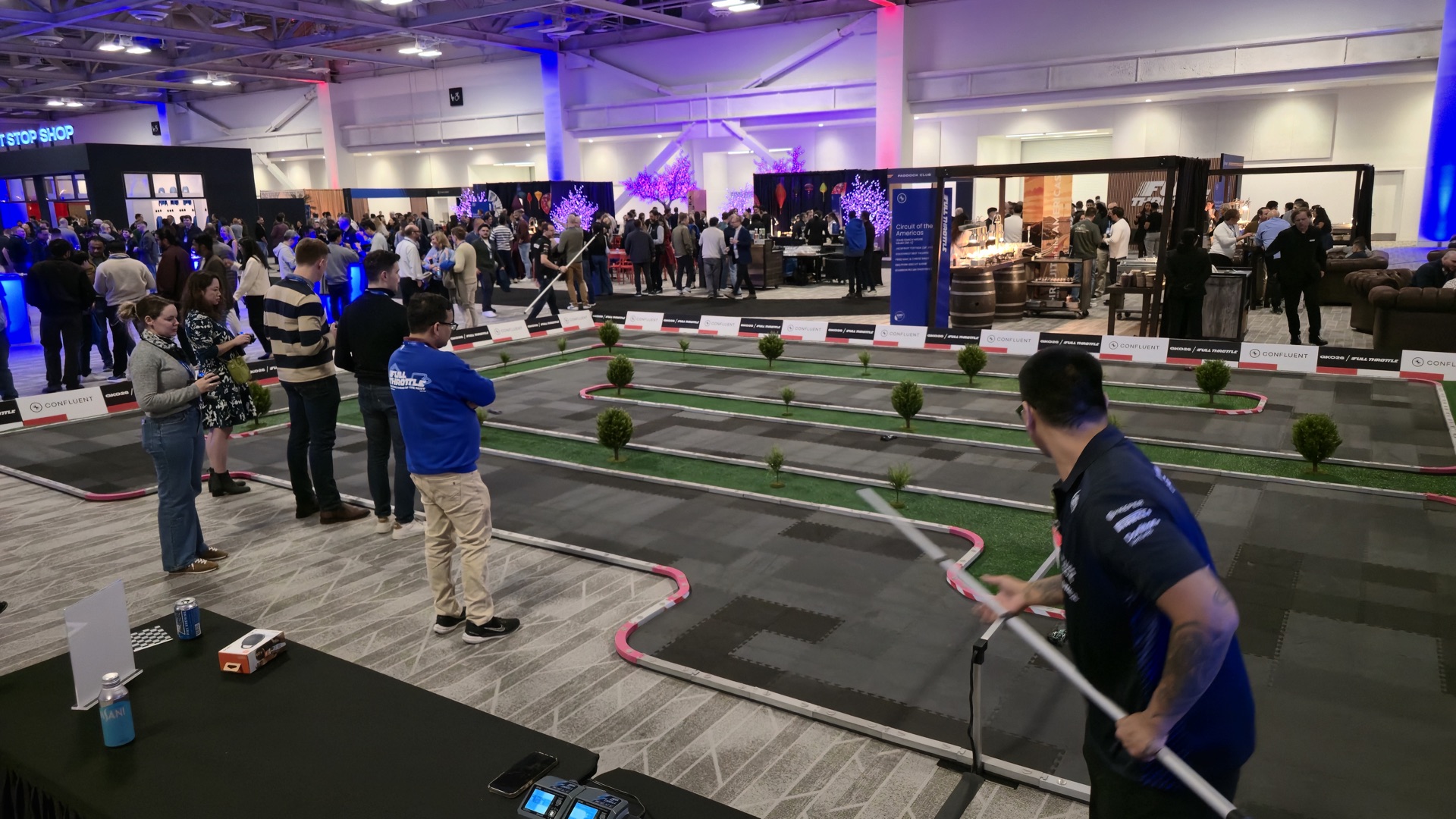 Race marshal running heats at a convention centre activation
