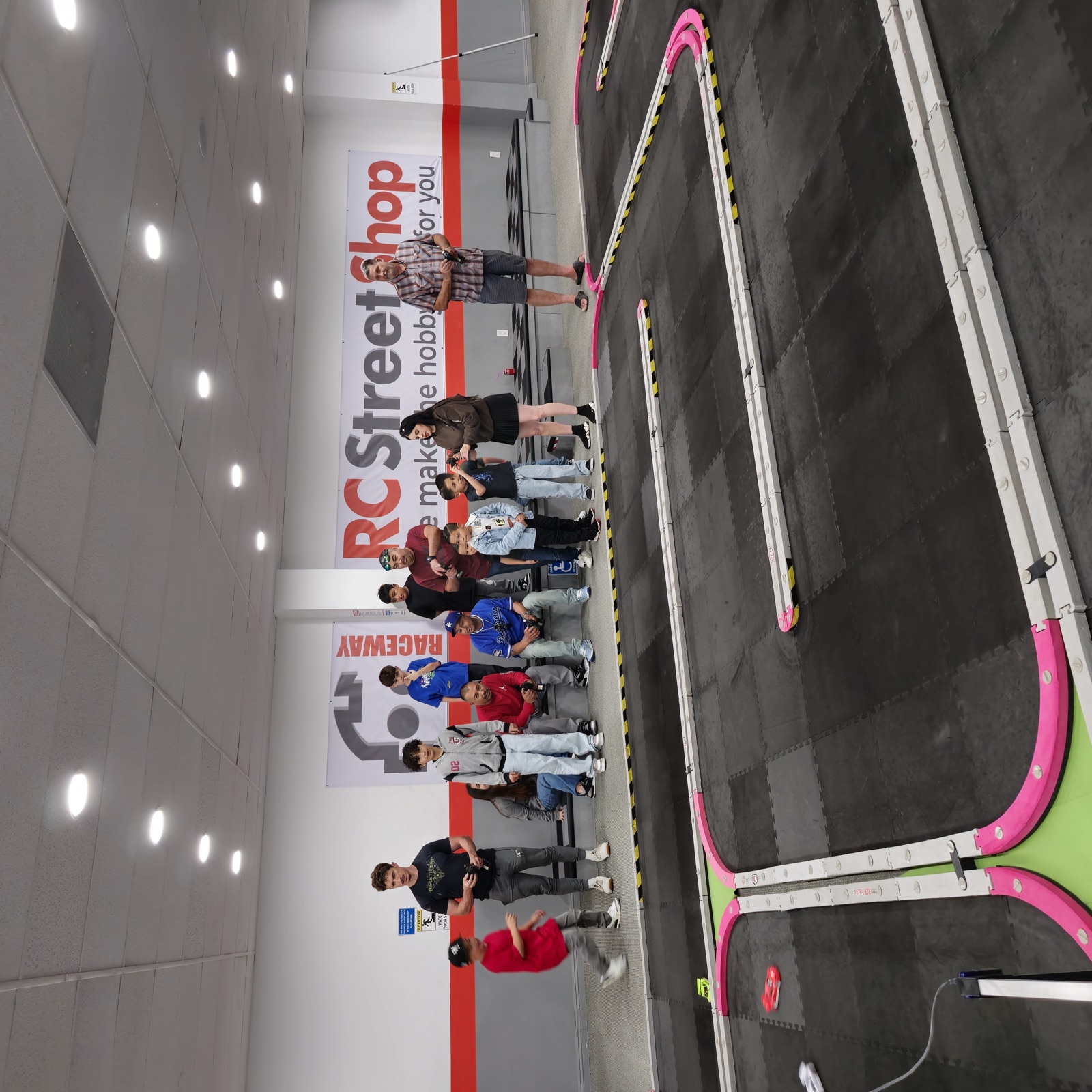 Kids racing RC cars on the indoor track in Los Angeles
