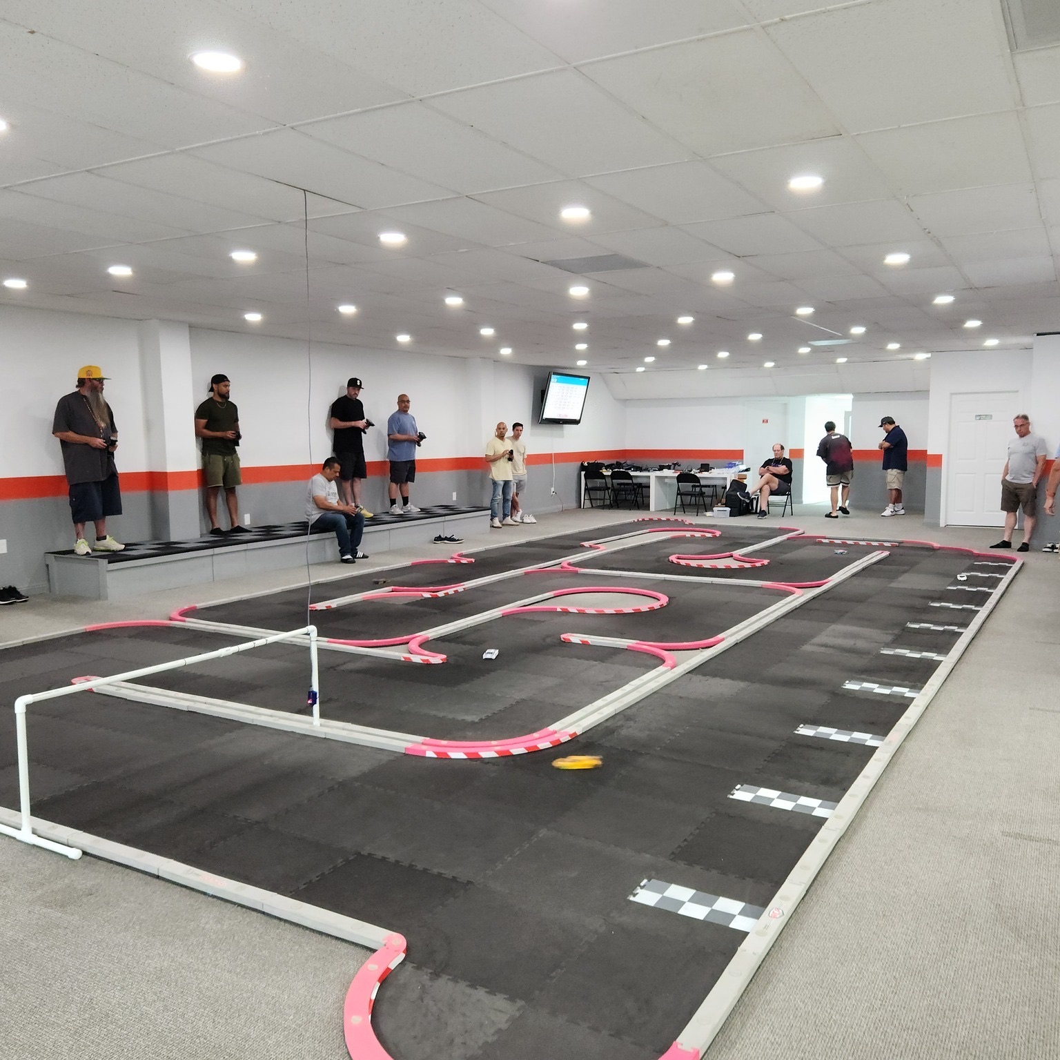 Racers on the drivers stand during an RC racing tournament